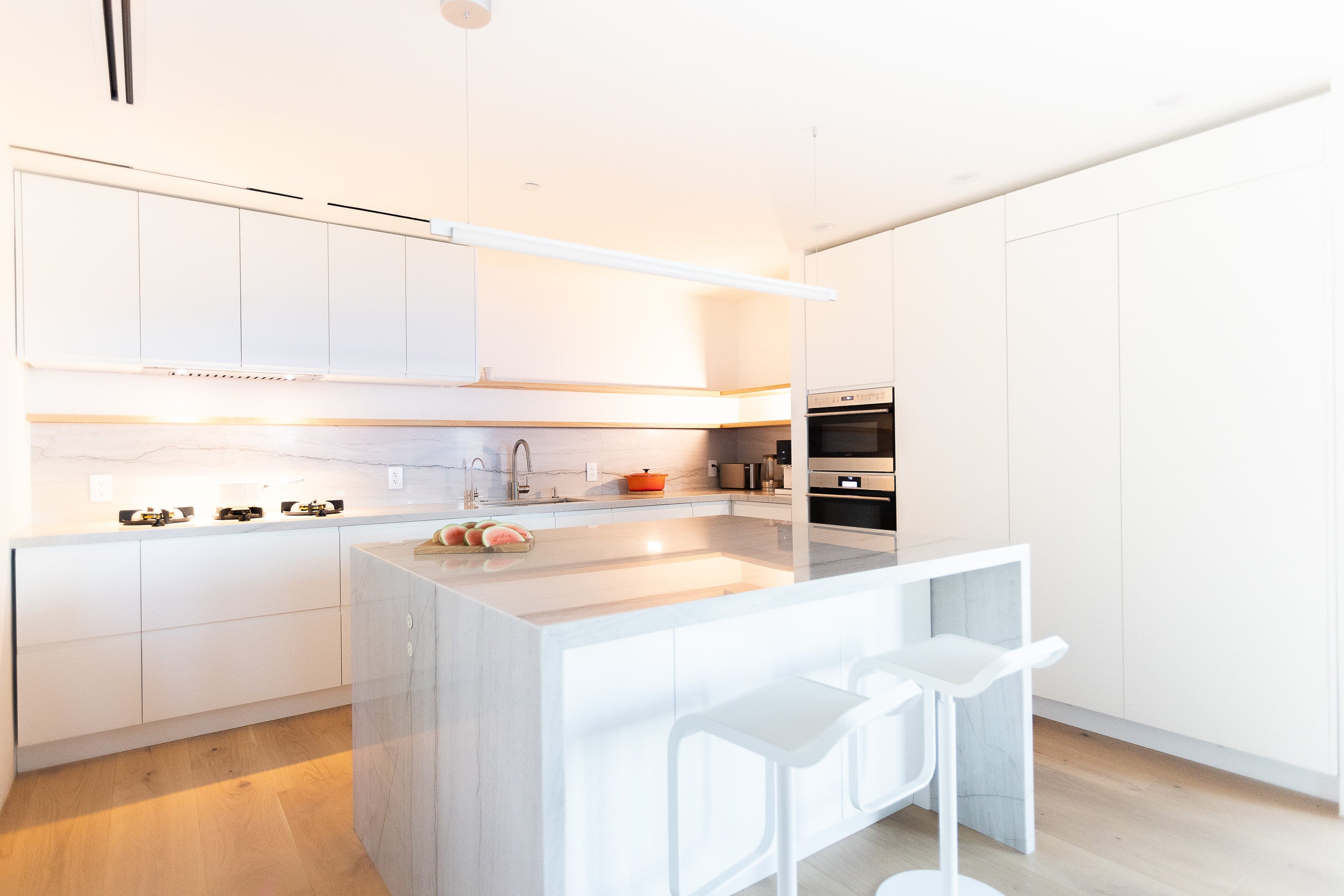 Matte white kitchen overview with San Francisco Bay backdrop